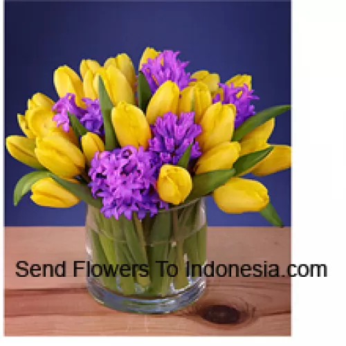 Yellow Tulips Arranged Beautifully In A Glass Vase - Please Note That In Case Of Non-Availability Of Certain Seasonal Flowers The Same Will Be Substituted With Other Flowers Of Same Value