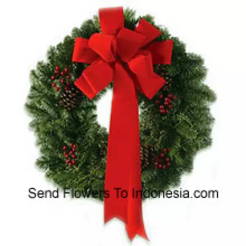 This stylish wreath with an extravagant red silk ribbon is made so your dear ones can celebrate Christmas with style (Please Note That We Reserve The Right To Substitute Any Product With A Suitable Product Of Equal Value In Case Of Non-Availability Of A Certain Product)